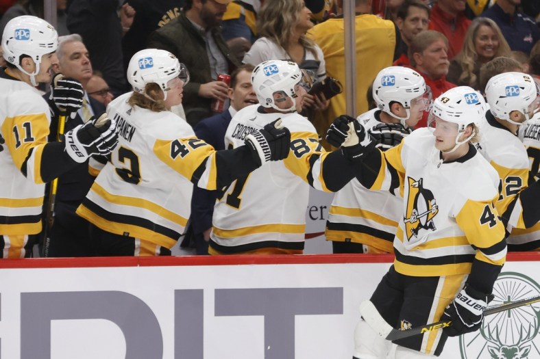 Dec 10, 2021; Washington, District of Columbia, USA; Pittsburgh Penguins center Danton Heinen (43) celebrates with teammates after scoring a goal against the Washington Capitals during the first period at Capital One Arena. Mandatory Credit: Geoff Burke-USA TODAY Sports
