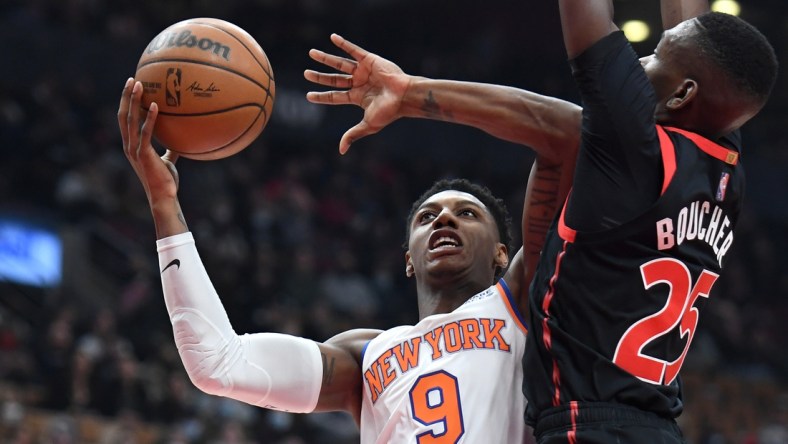 Dec 10, 2021; Toronto, Ontario, CAN;  New York Knicks forward RJ Barrett (9) shoots the ball against Toronto Raptors forward Chris Boucher (25) in the first half at Scotiabank Arena. Mandatory Credit: Dan Hamilton-USA TODAY Sports