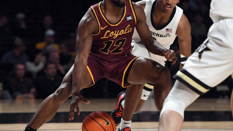 Dec 10, 2021; Nashville, Tennessee, USA; Loyola Ramblers guard Marquise Kennedy (12) drives the ball down the baseline during the first half against the Vanderbilt Commodores at Memorial Gymnasium. Mandatory Credit: Christopher Hanewinckel-USA TODAY Sports