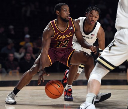 Dec 10, 2021; Nashville, Tennessee, USA; Loyola Ramblers guard Marquise Kennedy (12) drives the ball down the baseline during the first half against the Vanderbilt Commodores at Memorial Gymnasium. Mandatory Credit: Christopher Hanewinckel-USA TODAY Sports