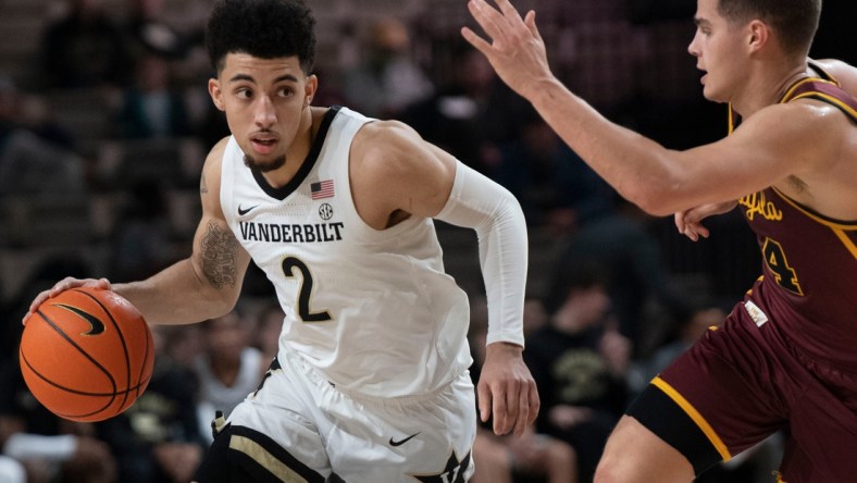 Vanderbilt Commodores guard Scotty Pippen Jr. (2) drives past Loyola Ramblers guard Tate Hall (24) during the first half at Memorial Gymnasium Friday, Dec. 10, 2021 in Nashville, Tenn.

Nas Vandy Loyola 010