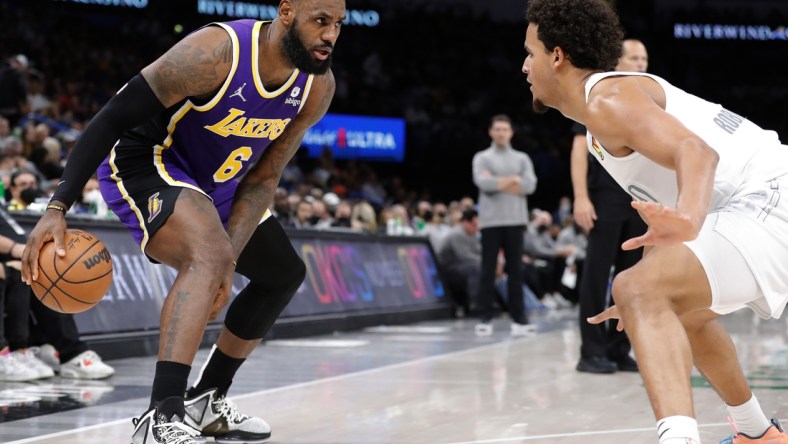 Dec 10, 2021; Oklahoma City, Oklahoma, USA; Oklahoma City Thunder forward Jeremiah Robinson-Earl (50) defends Los Angeles Lakers forward LeBron James (6) during the second quarter at Paycom Center. Mandatory Credit: Alonzo Adams-USA TODAY Sports