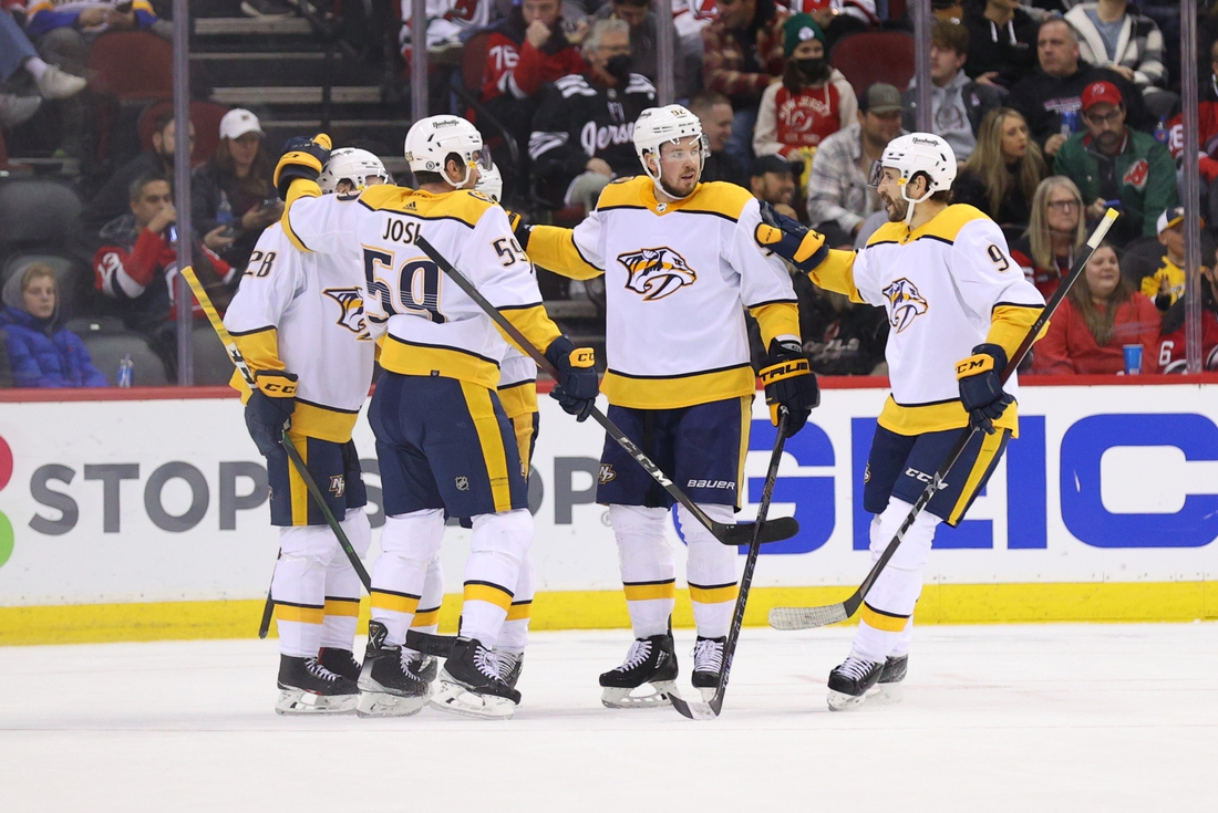 Dec 10, 2021; Newark, New Jersey, USA; Nashville Predators right wing Eeli Tolvanen (28) celebrates his goal against the New Jersey Devils during the second period at Prudential Center. Mandatory Credit: Ed Mulholland-USA TODAY Sports