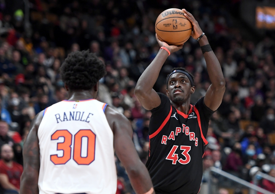 Dec 10, 2021; Toronto, Ontario, CAN;  Toronto Raptors forward Pascal Siakam (43) shoots against New York Knicks forward Julius Randle (30) in the second half at Scotiabank Arena. Mandatory Credit: Dan Hamilton-USA TODAY Sports