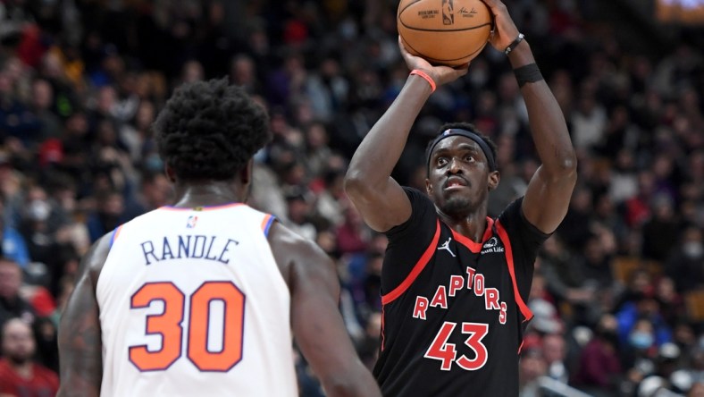 Dec 10, 2021; Toronto, Ontario, CAN;  Toronto Raptors forward Pascal Siakam (43) shoots against New York Knicks forward Julius Randle (30) in the second half at Scotiabank Arena. Mandatory Credit: Dan Hamilton-USA TODAY Sports