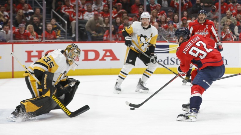 Dec 10, 2021; Washington, District of Columbia, USA; Washington Capitals center Evgeny Kuznetsov (92) scores a goal on Pittsburgh Penguins goaltender Tristan Jarry (35) during the third period at Capital One Arena. Mandatory Credit: Geoff Burke-USA TODAY Sports