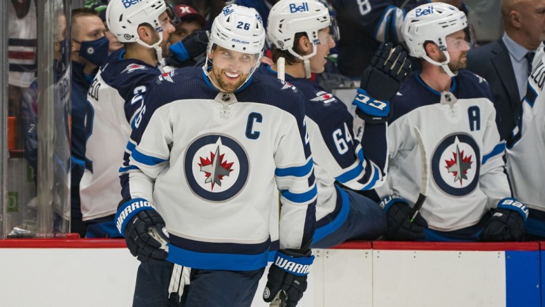 Dec 10, 2021; Vancouver, British Columbia, CAN; Winnipeg Jets forward Blake Wheeler (26) celebrate his goal against the Vancouver Canucks in the first period at Rogers Arena. Mandatory Credit: Bob Frid-USA TODAY Sports