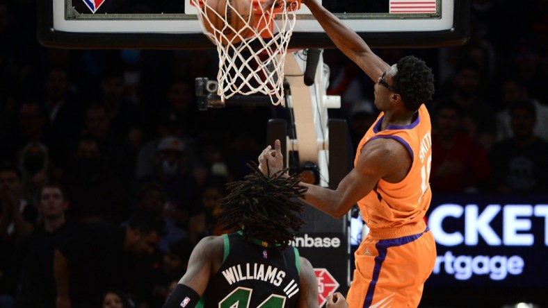 Dec 10, 2021; Phoenix, Arizona, USA; Phoenix Suns forward Jalen Smith (10) dunks over Boston Celtics center Robert Williams III (44) during the first half at Footprint Center. Mandatory Credit: Joe Camporeale-USA TODAY Sports