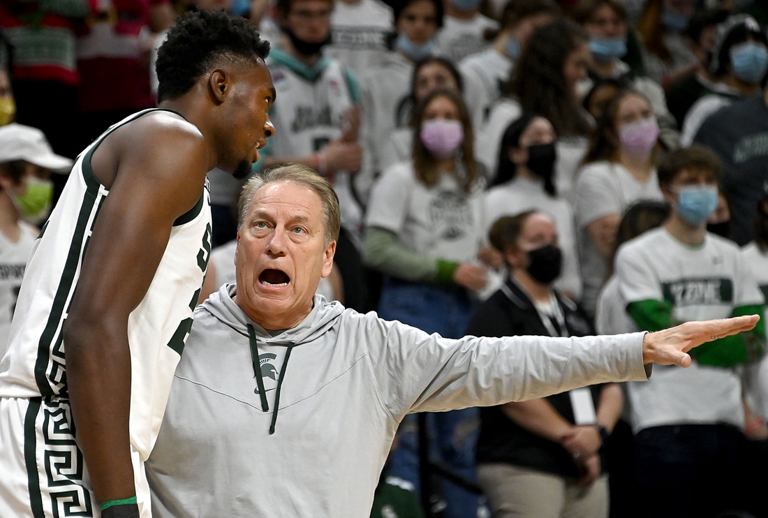 Dec 11, 2021; East Lansing, Michigan, USA;  Michigan State Spartans head coach Tom Izzo talks to center Mady Sissoko (22) on the sideline in the first half at Jack Breslin Student Events Center. Mandatory Credit: Dale Young-USA TODAY Sports