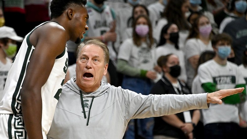 Dec 11, 2021; East Lansing, Michigan, USA;  Michigan State Spartans head coach Tom Izzo talks to center Mady Sissoko (22) on the sideline in the first half at Jack Breslin Student Events Center. Mandatory Credit: Dale Young-USA TODAY Sports