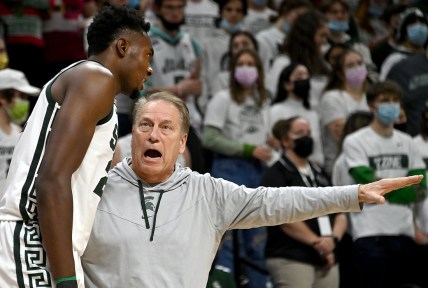Dec 11, 2021; East Lansing, Michigan, USA;  Michigan State Spartans head coach Tom Izzo talks to center Mady Sissoko (22) on the sideline in the first half at Jack Breslin Student Events Center. Mandatory Credit: Dale Young-USA TODAY Sports