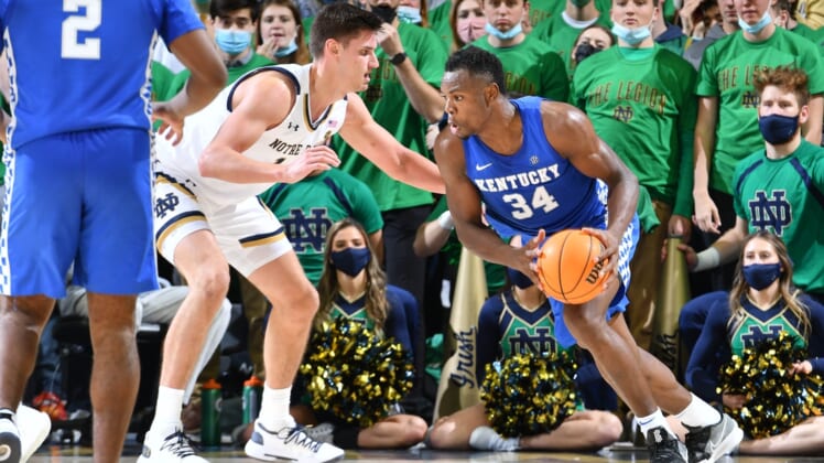 Dec 11, 2021; South Bend, Indiana, USA; Kentucky Wildcats forward Oscar Tshiebwe (34) drives to the basket as Notre Dame Fighting Irish forward Nate Laszewski (14) defends in the second half at the Purcell Pavilion. Mandatory Credit: Matt Cashore-USA TODAY Sports