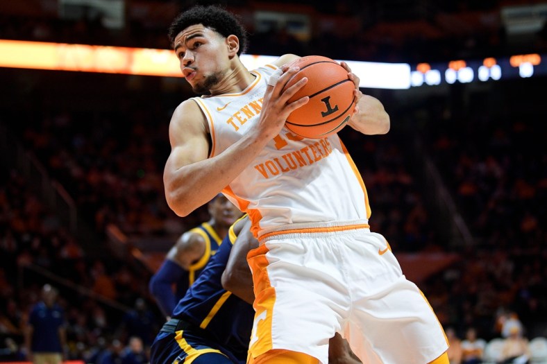 Tennessee forward Olivier Nkamhoua (13) drives the ball toward the net during a game at Thompson-Boling Arena in Knoxville, Tenn. on Saturday, Dec. 11, 2021.

Kns Tennessee Greensboro Basketball