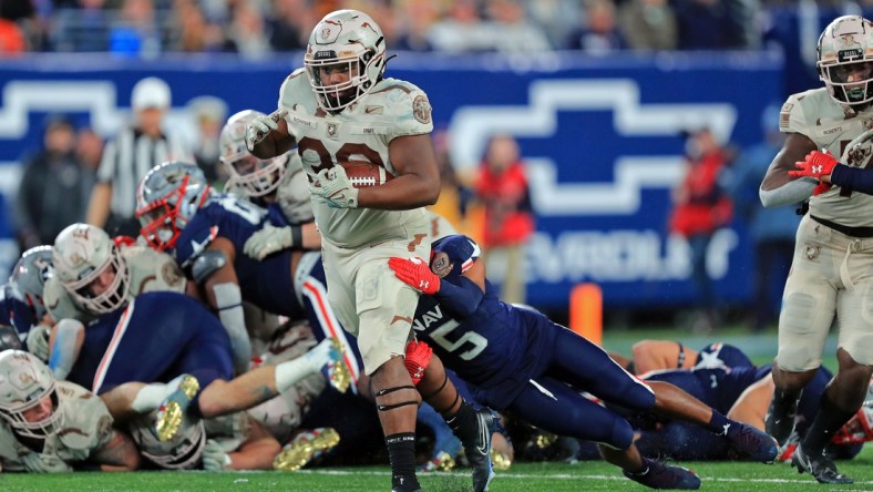 Dec 11, 2021; East Rutherford, New Jersey, USA; Army Black Knights running back Jakobi Buchanan (33) carries the ball against the Navy Midshipmen during the second half of the 122nd Army-Navy game. Mandatory Credit: Danny Wild-USA TODAY Sports