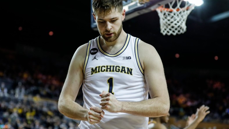 Michigan center Hunter Dickinson (1) reacts a play against Minnesota during the second half at the Crisler Center in Ann Arbor on Saturday, Dec. 11, 2021.