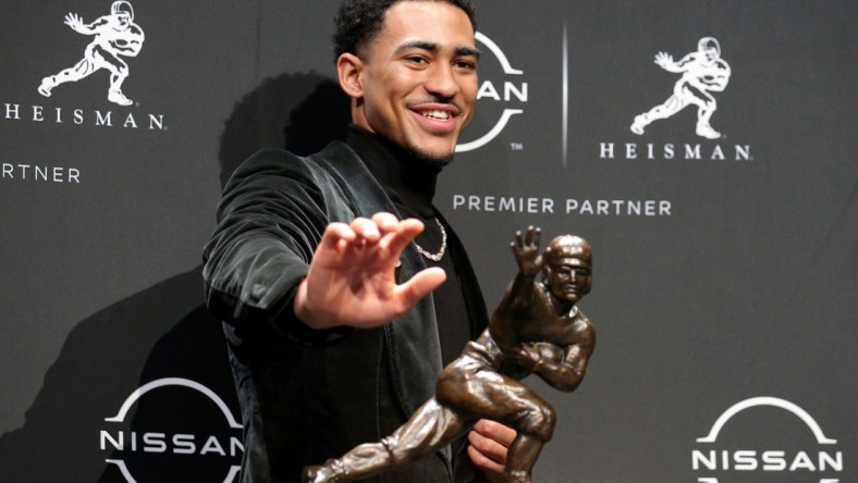 Dec 11, 2021; New York, NY, USA; 2021 Heisman winner Alabama quarterback Bryce Young poses for pictures with the trophy during a press conference at the New York Marriott Marquis in New York City. Mandatory Credit: Brad Penner-USA TODAY Sports