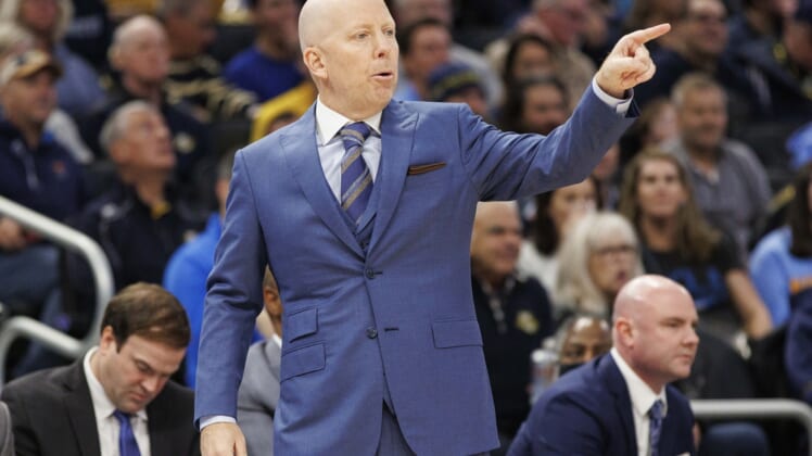 Dec 11, 2021; Milwaukee, Wisconsin, USA;  UCLA Bruins head coach Mick Cronin signals during the first half against the Marquette Golden Eagles at Fiserv Forum. Mandatory Credit: Jeff Hanisch-USA TODAY Sports