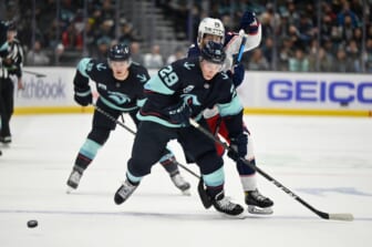 Dec 11, 2021; Seattle, Washington, USA; Seattle Kraken defenseman Vince Dunn (29) receives a pass while being defended by Columbus Blue Jackets right wing Oliver Bjorkstrand (28) during the first period at Climate Pledge Arena. Mandatory Credit: Steven Bisig-USA TODAY Sports