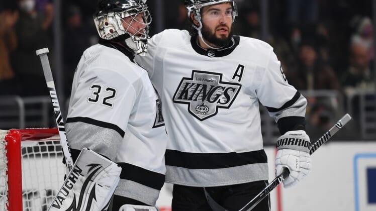 Dec 11, 2021; Los Angeles, California, USA;  Los Angeles Kings defenseman Drew Doughty (8) congratulates goaltender Jonathan Quick (32) after the game against the Minnesota Wild at Staples Center. Mandatory Credit: Jayne Kamin-Oncea-USA TODAY Sports