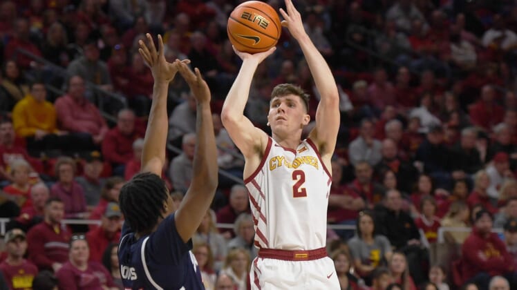 Iowa State guard Caleb Grill (2) takes a shot over Jackson State's forward Jamarcus Jones (31) during the first half at Hilton Coliseum Sunday, Dec. 12, 2021, in Ames, Iowa