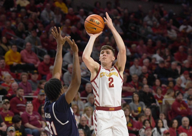 Iowa State guard Caleb Grill (2) takes a shot over Jackson State's forward Jamarcus Jones (31) during the first half at Hilton Coliseum Sunday, Dec. 12, 2021, in Ames, Iowa