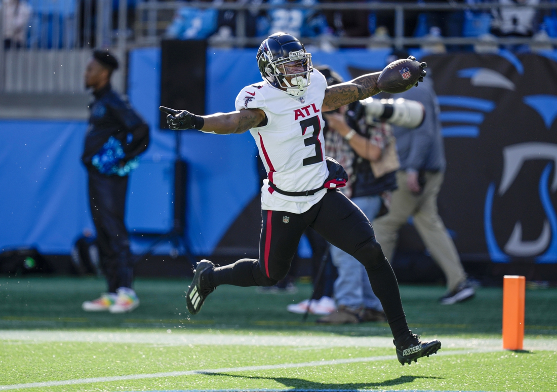 Dec 12, 2021; Charlotte, North Carolina, USA; Atlanta Falcons linebacker Mykal Walker (3) returns an interception thrown by Carolina Panthers quarterback Cam Newton (not pictured) for a touchdown during the second quarter at Bank of America Stadium. Mandatory Credit: Jim Dedmon-USA TODAY Sports