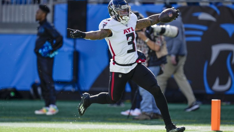 Dec 12, 2021; Charlotte, North Carolina, USA; Atlanta Falcons linebacker Mykal Walker (3) returns an interception thrown by Carolina Panthers quarterback Cam Newton (not pictured) for a touchdown during the second quarter at Bank of America Stadium. Mandatory Credit: Jim Dedmon-USA TODAY Sports