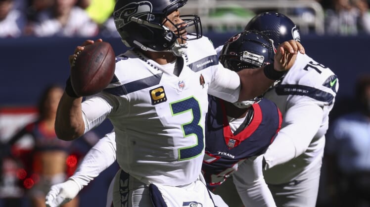 Dec 12, 2021; Houston, Texas, USA; Seattle Seahawks quarterback Russell Wilson (3) attempts a pass during the second quarter against the Houston Texans at NRG Stadium. Mandatory Credit: Troy Taormina-USA TODAY Sports