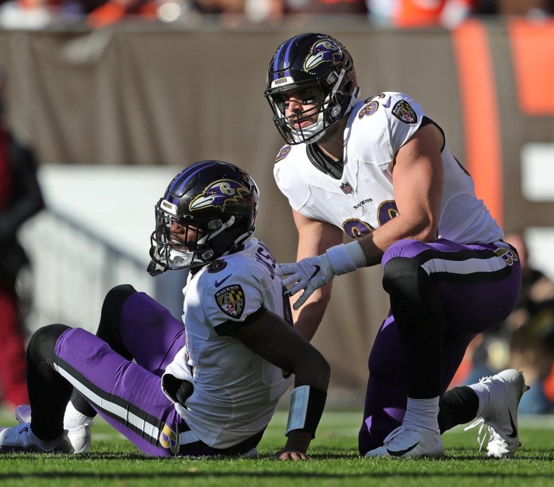 Baltimore Ravens quarterback Lamar Jackson (8) sits on the ground after an injury during the first half of an NFL football game at FirstEnergy Stadium, Sunday, Dec. 12, 2021, in Cleveland, Ohio. [Jeff Lange/Beacon Journal]

Browns 3