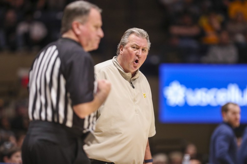 Dec 12, 2021; Morgantown, West Virginia, USA; West Virginia Mountaineers head coach Bob Huggins argues a call during the first half against the Kent State Golden Flashes at WVU Coliseum. Mandatory Credit: Ben Queen-USA TODAY Sports