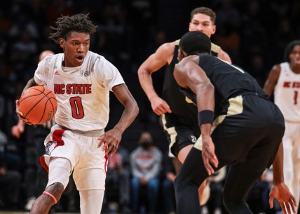 Dec 12, 2021; Brooklyn, New York, USA; North Carolina State Wolfpack guard Terquavion Smith (0) dribbles up court  againstNorth Carolina State Wolfpack guard Thomas Allen (5) during the second half at Barclays Center. Mandatory Credit: Vincent Carchietta-USA TODAY Sports
