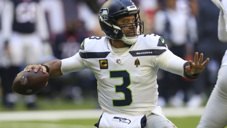 Dec 12, 2021; Houston, Texas, USA; Seattle Seahawks quarterback Russell Wilson (3) passes against the Houston Texans  in the second half at NRG Stadium. Mandatory Credit: Thomas Shea-USA TODAY Sports