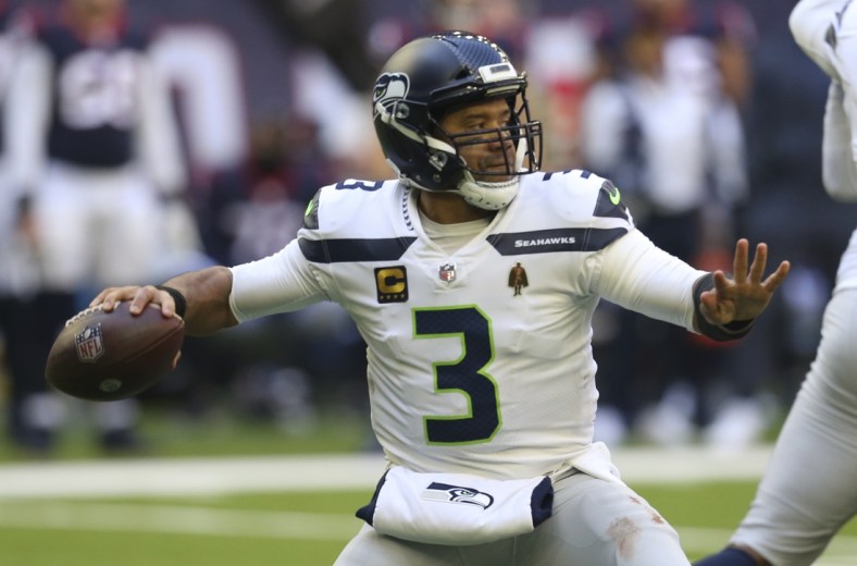 Dec 12, 2021; Houston, Texas, USA; Seattle Seahawks quarterback Russell Wilson (3) passes against the Houston Texans  in the second half at NRG Stadium. Mandatory Credit: Thomas Shea-USA TODAY Sports