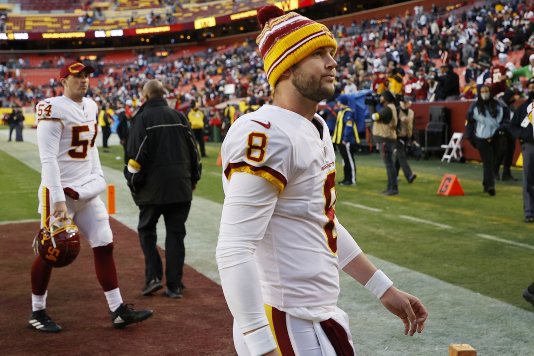 Dec 12, 2021; Landover, Maryland, USA; Washington Football Team quarterback Kyle Allen (8) leaves. The field after the game against the Dallas Cowboys at FedExField. Mandatory Credit: Geoff Burke-USA TODAY Sports