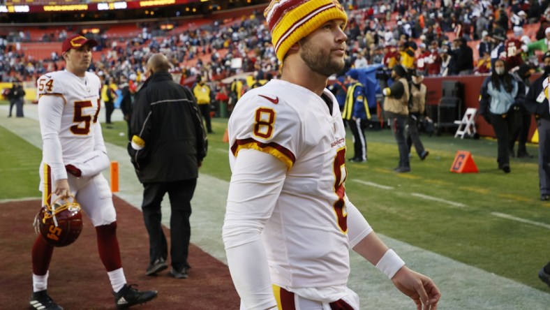 Dec 12, 2021; Landover, Maryland, USA; Washington Football Team quarterback Kyle Allen (8) leaves. The field after the game against the Dallas Cowboys at FedExField. Mandatory Credit: Geoff Burke-USA TODAY Sports