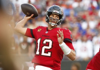 Dec 12, 2021; Tampa, Florida, USA; Tampa Bay Buccaneers quarterback Tom Brady (12) throws the ball against the Buffalo Bills during the first half at Raymond James Stadium. Mandatory Credit: Kim Klement-USA TODAY Sports