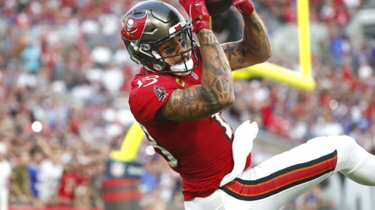 Dec 12, 2021; Tampa, Florida, USA; Tampa Bay Buccaneers wide receiver Mike Evans (13) catches the ball for a touchdown against the Buffalo Bills during the first half at Raymond James Stadium. Mandatory Credit: Kim Klement-USA TODAY Sports