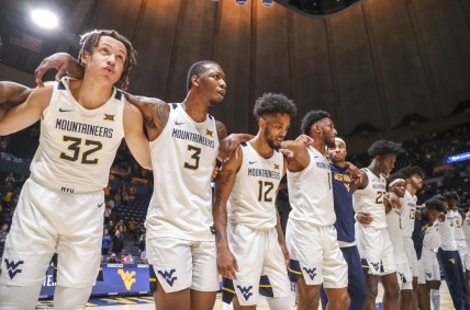 Dec 12, 2021; Morgantown, West Virginia, USA; West Virginia Mountaineers players celebrate after defeating the Kent State Golden Flashes at WVU Coliseum. Mandatory Credit: Ben Queen-USA TODAY Sports