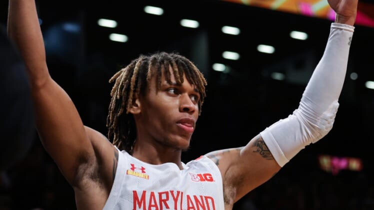 Dec 12, 2021; Brooklyn, New York, USA; Maryland Terrapins guard Fatts Russell (4) celebrates after the game against the Florida Gators at Barclays Center. Mandatory Credit: Vincent Carchietta-USA TODAY Sports