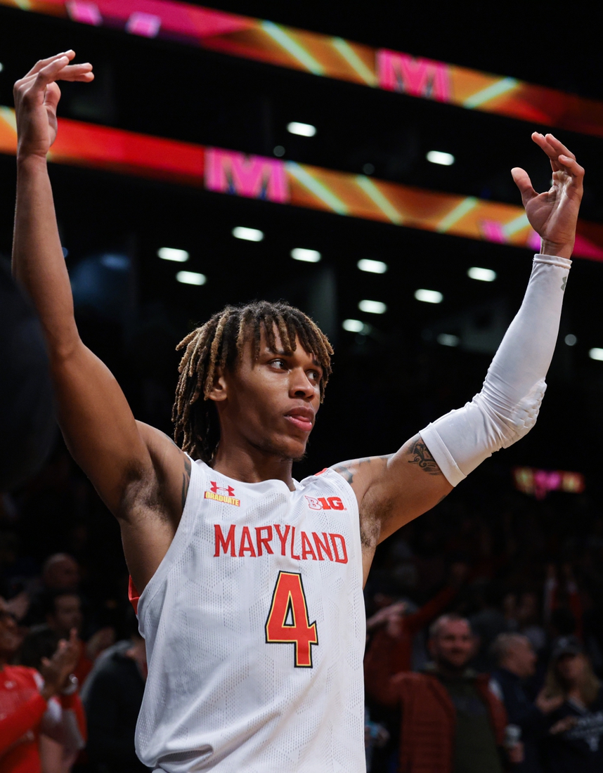 Dec 12, 2021; Brooklyn, New York, USA; Maryland Terrapins guard Fatts Russell (4) celebrates after the game against the Florida Gators at Barclays Center. Mandatory Credit: Vincent Carchietta-USA TODAY Sports