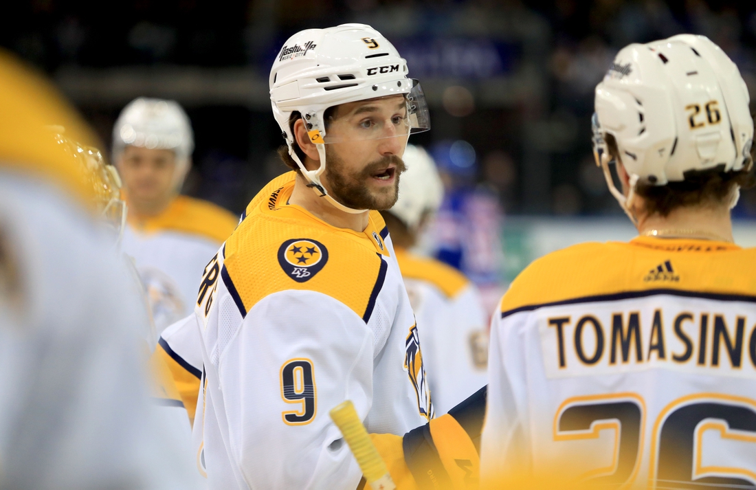 Dec 12, 2021; New York, New York, USA; Nashville Predators left wing Filip Forsberg (9) speaks with center Philip Tomasino (26) during a break against the New York Rangers during the first period at Madison Square Garden. Mandatory Credit: Danny Wild-USA TODAY Sports