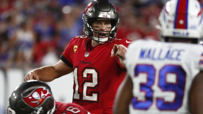 Dec 12, 2021; Tampa, Florida, USA;Tampa Bay Buccaneers quarterback Tom Brady (12) points against the Buffalo Bills  during the first half at Raymond James Stadium. Mandatory Credit: Kim Klement-USA TODAY Sports