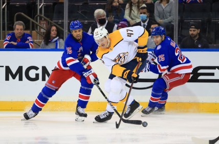 Dec 12, 2021; New York, New York, USA; Nashville Predators right wing Michael McCarron (47) fights for the puck with New York Rangers right wing Ryan Reaves (75) and New York Rangers defenseman Libor Hajek (25) during the second period at Madison Square Garden. Mandatory Credit: Danny Wild-USA TODAY Sports