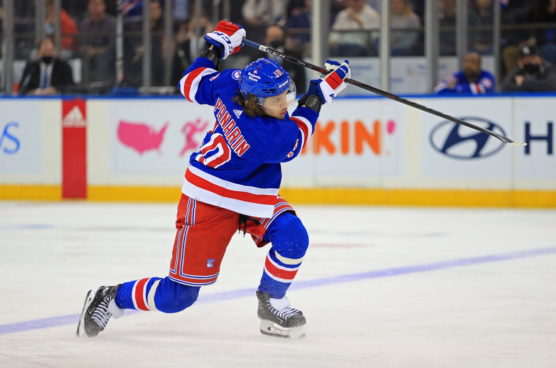 Dec 12, 2021; New York, New York, USA; New York Rangers left wing Artemi Panarin (10) takes a shot against the Nashville Predators during the third period at Madison Square Garden. Mandatory Credit: Danny Wild-USA TODAY Sports