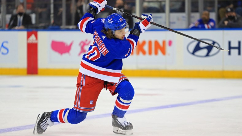 Dec 12, 2021; New York, New York, USA; New York Rangers left wing Artemi Panarin (10) takes a shot against the Nashville Predators during the third period at Madison Square Garden. Mandatory Credit: Danny Wild-USA TODAY Sports