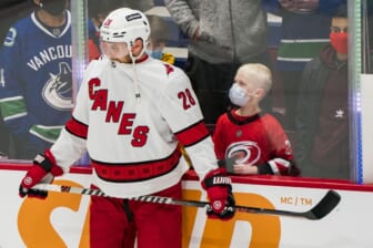Dec 12, 2021; Vancouver, British Columbia, CAN;  A young fan reacts after seeing Carolina Hurricanes defenseman Ian Cole (28) up close prior to the start of a game against the Vancouver Canucks at Rogers Arena. Mandatory Credit: Bob Frid-USA TODAY Sports