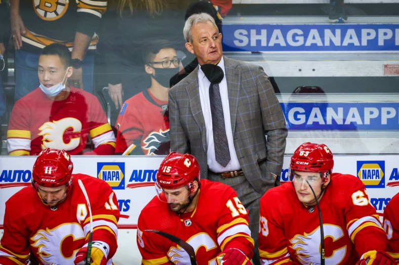 Dec 11, 2021; Calgary, Alberta, CAN; Calgary Flames head coach Darryl Sutter on his bench against the Boston Bruins during the third period at Scotiabank Saddledome. Mandatory Credit: Sergei Belski-USA TODAY Sports