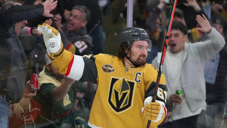 Dec 12, 2021; Las Vegas, Nevada, USA;  Vegas Golden Knights right wing Mark Stone (61) celebrates after scoring a third period goal against the Minnesota Wild at T-Mobile Arena. Mandatory Credit: Stephen R. Sylvanie-USA TODAY Sports
