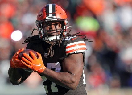 Cleveland Browns running back Kareem Hunt (27) rushes for yards during the first half of an NFL football game against the Baltimore Ravens at FirstEnergy Stadium, Sunday, Dec. 12, 2021, in Cleveland, Ohio. [Jeff Lange/Beacon Journal]

Browns 13