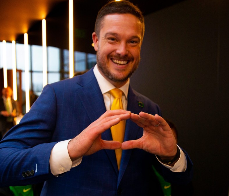 New University of Oregon football coach Dan Lanning flashes the "O" Monday after being introduced as the head coach for the Ducks in Eugene. Lanning  joins the Ducks in his first head coaching job.  Previously defensive coordinator for the University of Georgia (12-1), Lanning  was a hot commodity around college football circles, running a Georgia defense that is arguably the best in the country. Read more in Sports, Page 1B.

Eug 121321 Lanning 04